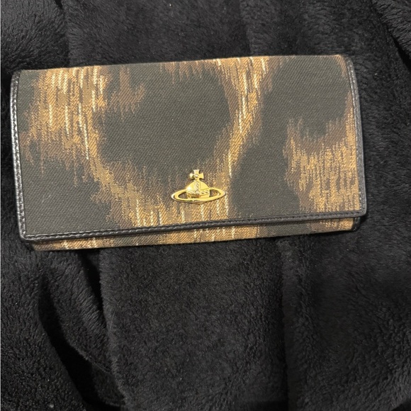 Vivienne Westwood Black and Gold Wallet with Distinctive Patina